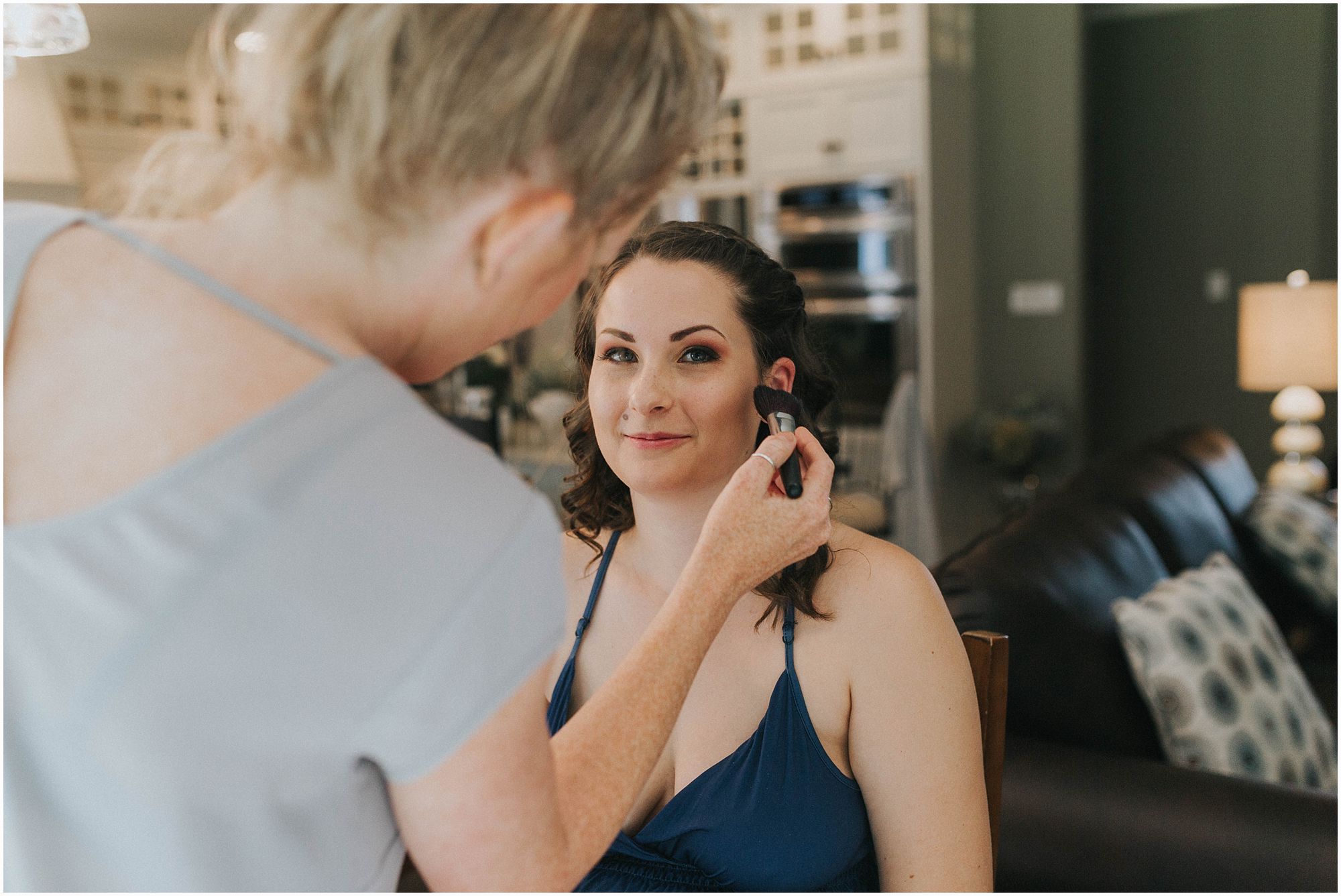 bridesmaid getting her makeup done