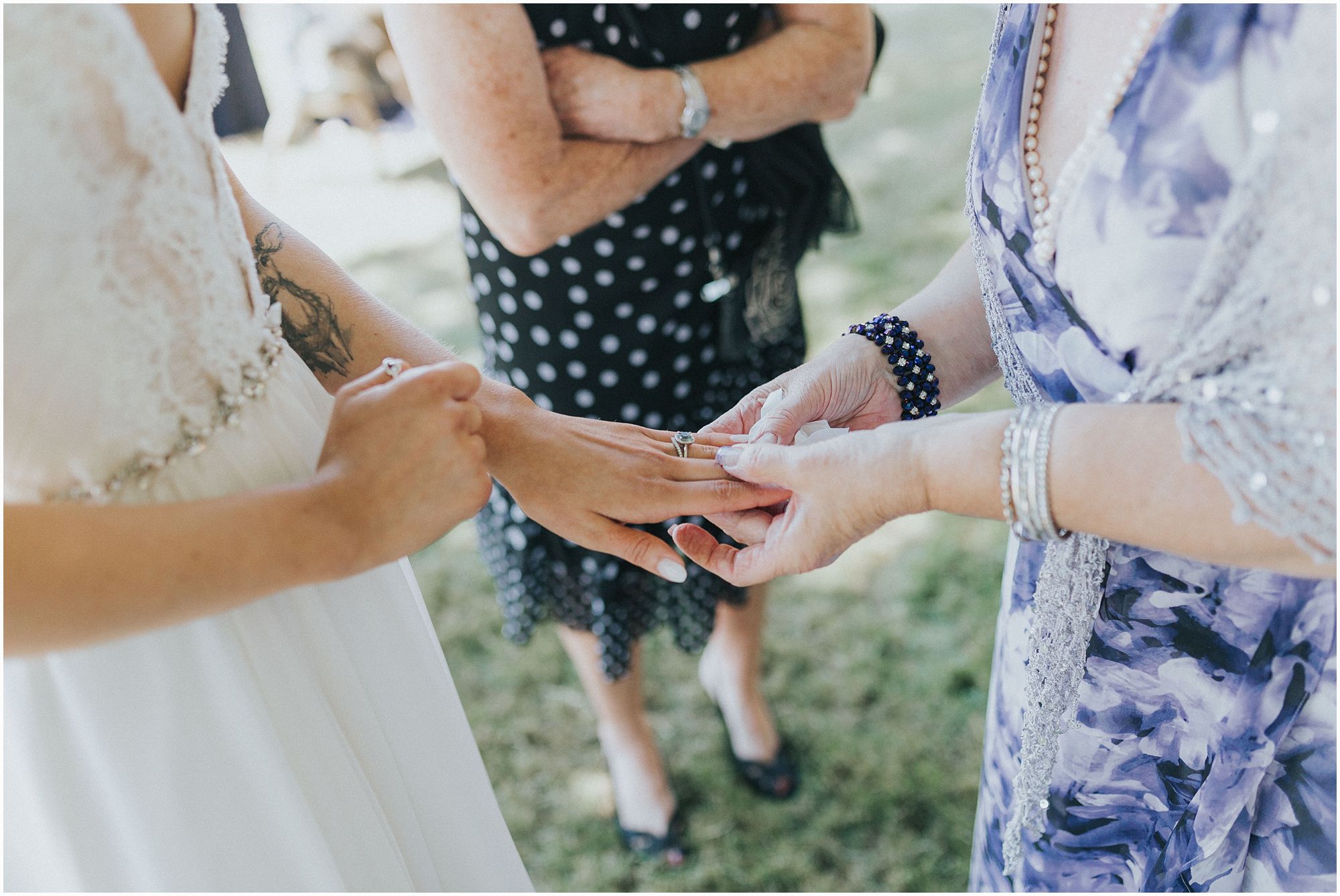 guests check out bride's ring