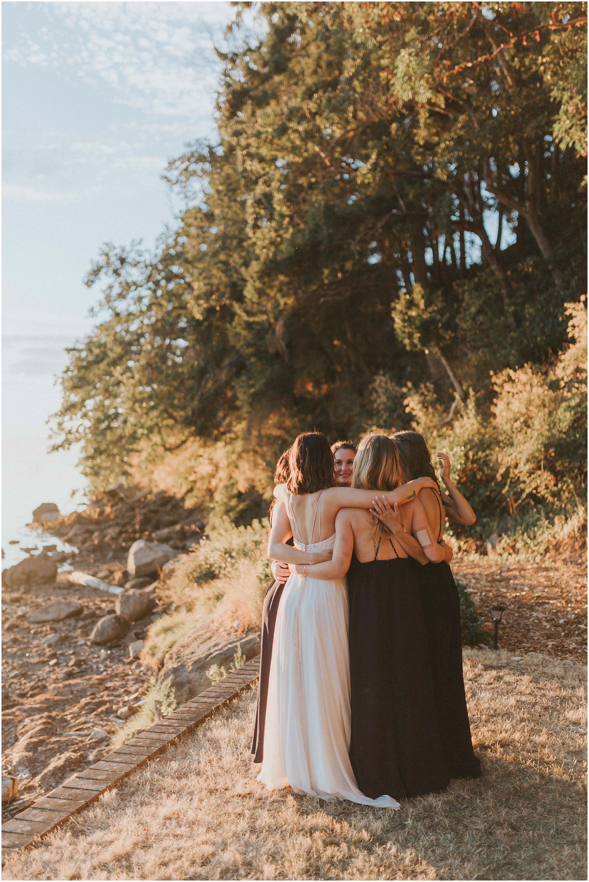 bridesmaids embracing 
