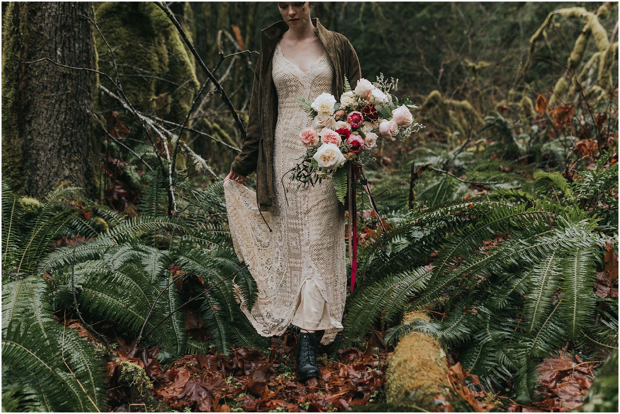 adventurous bride walking through forest with bouquet
